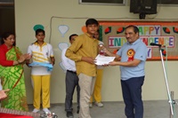 Honourable Director sir awarding the students