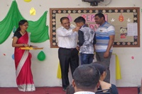 Honourable Director sir awarding the student